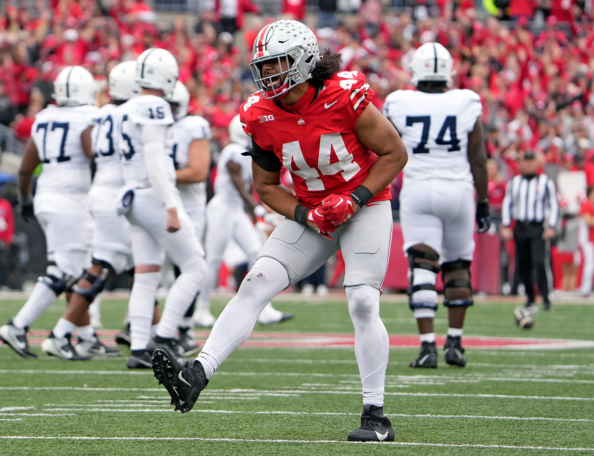 Oct 21, 2023; Columbus, Ohio, USA; Ohio State Buckeyes defensive end JT Tuimoloau (44) celebrates after stopping Penn State Nittany Lions on fourth down during the fourth quarter of their game at Ohio Stadium.