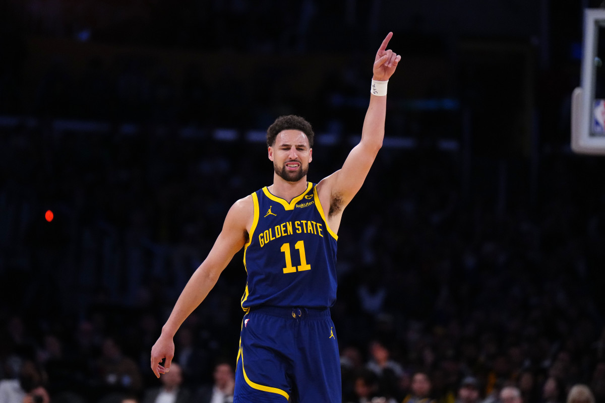 Apr 9, 2024; Los Angeles, California, USA; Golden State Warriors guard Klay Thompson (11) celebrates after a three-point shot against the Los Angeles Lakers in the second half at Crypto.com Arena.