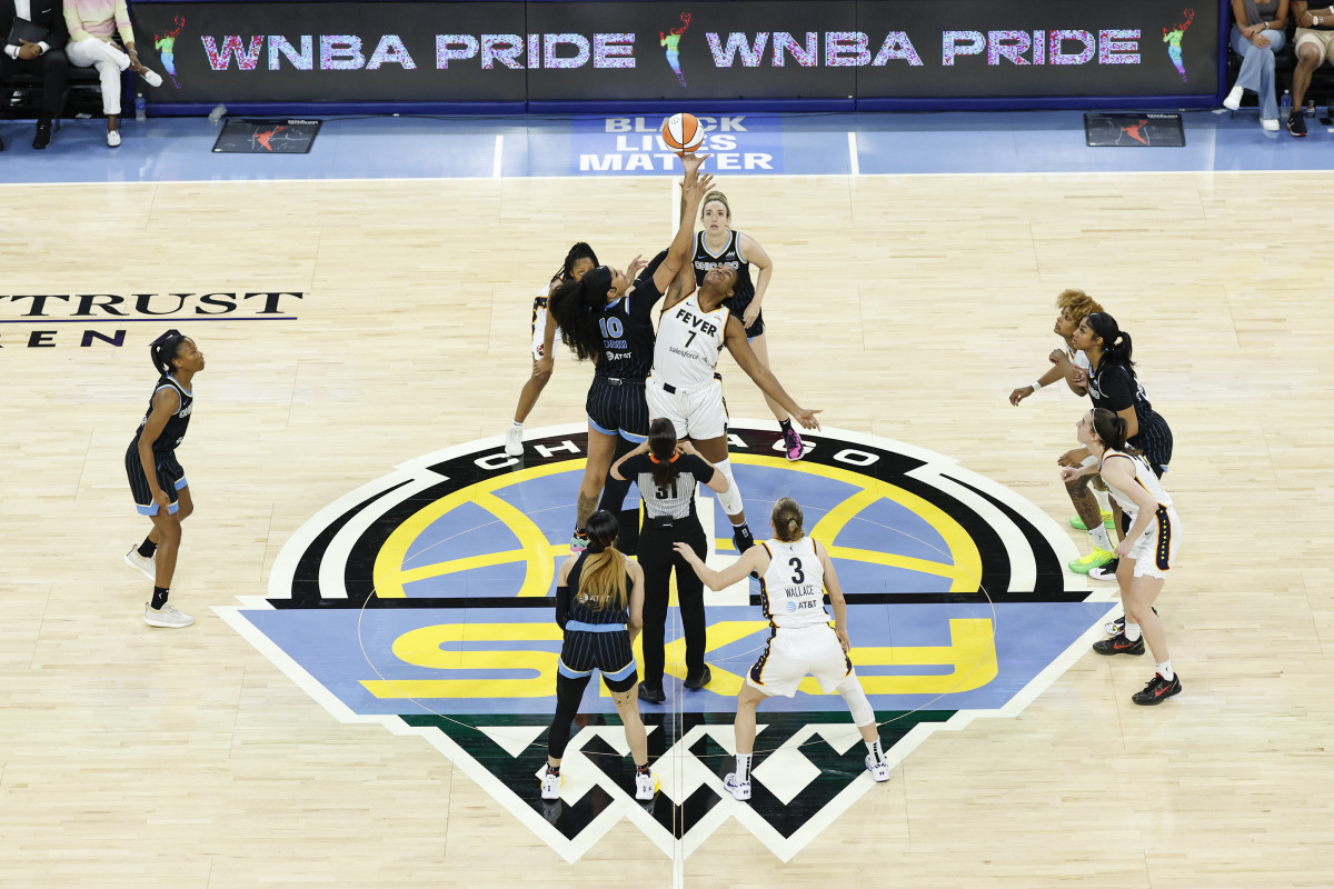 Jun 23, 2024; Chicago, Illinois, USA; Chicago Sky center Kamilla Cardoso (10) battles for the ball with Indiana Fever forward Aliyah Boston (7) at the tip-off of a basketball game at Wintrust Arena.