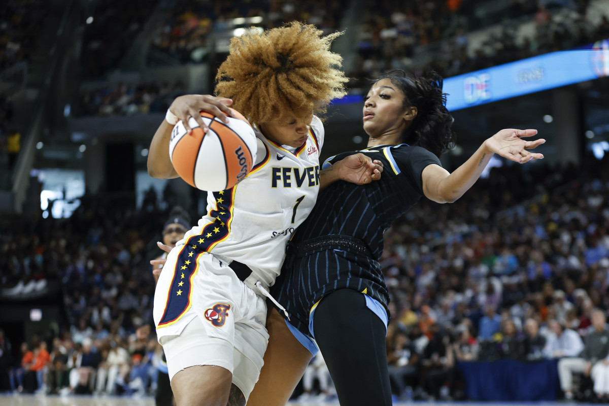 Indiana Fever forward NaLyssa Smith (1) drives to the basket against Chicago Sky forward Angel Reese.