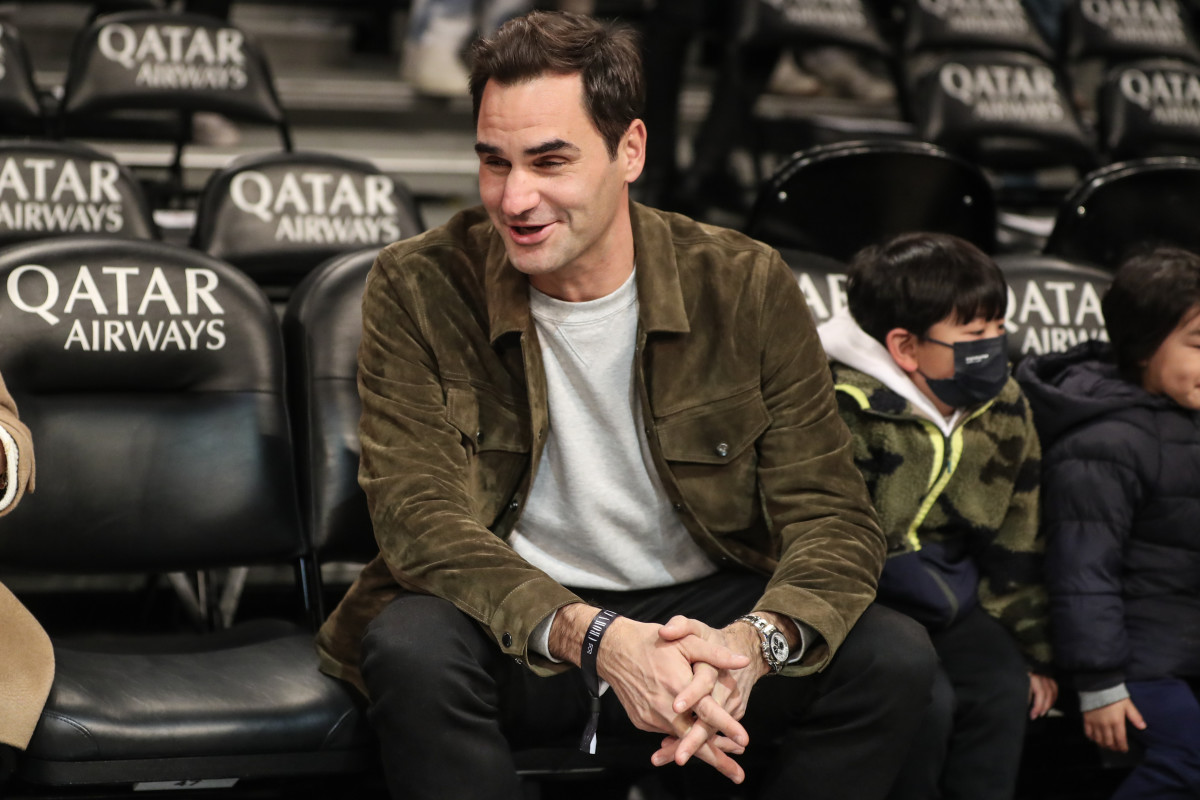 Former tennis champion Roger Federer watches the warmups