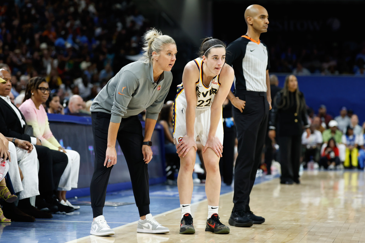 Indiana Fever head coach Christie Sides talks with guard Caitlin Clark at Wintrust Arena on June 23, 2024.