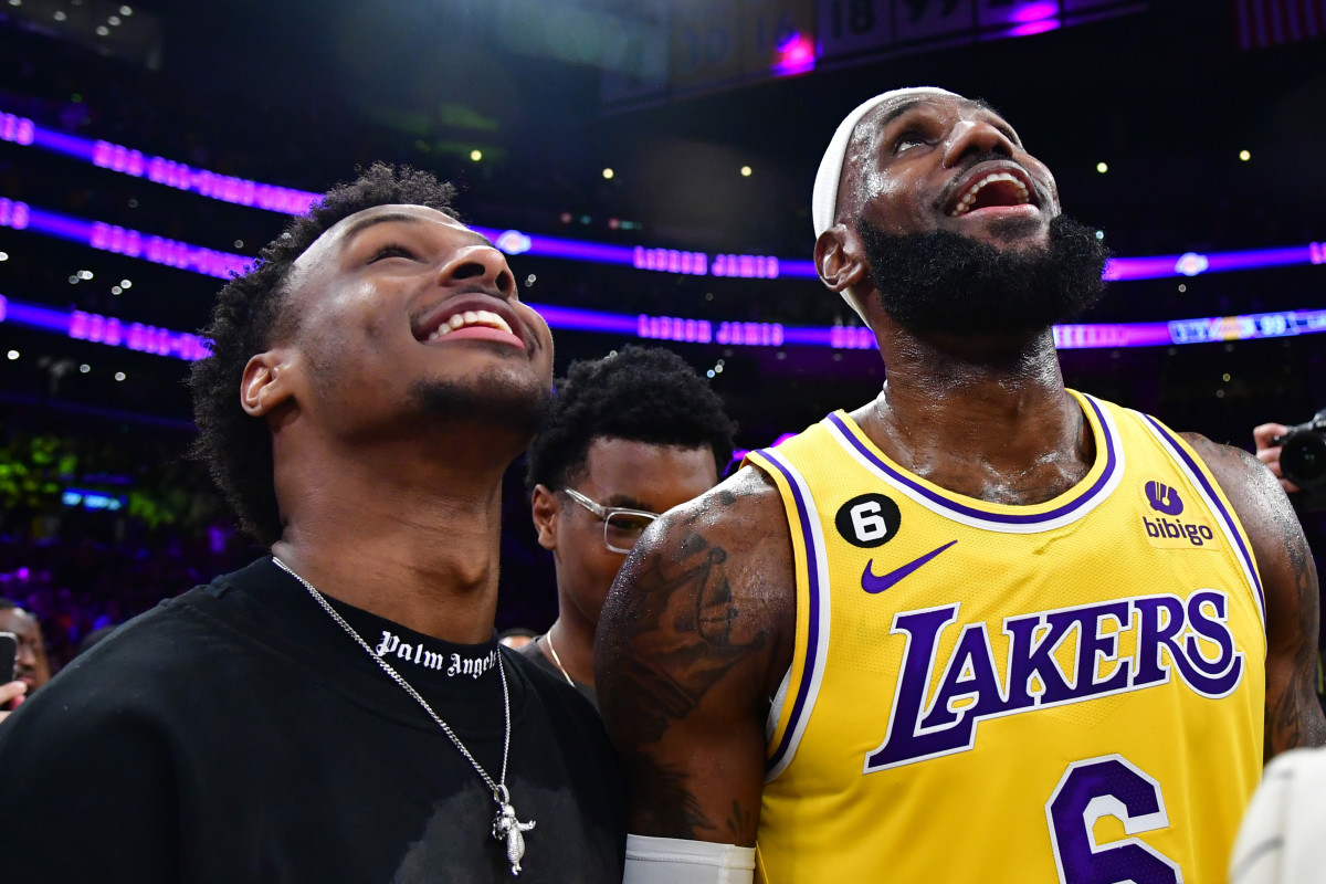 Feb 7, 2023; Los Angeles, California, USA; Los Angeles Lakers forward LeBron James (6) celebrates with his son Bronny James after breaking the all-time scoring record in the third quarter against the Oklahoma City Thunder at Crypto.com Arena.