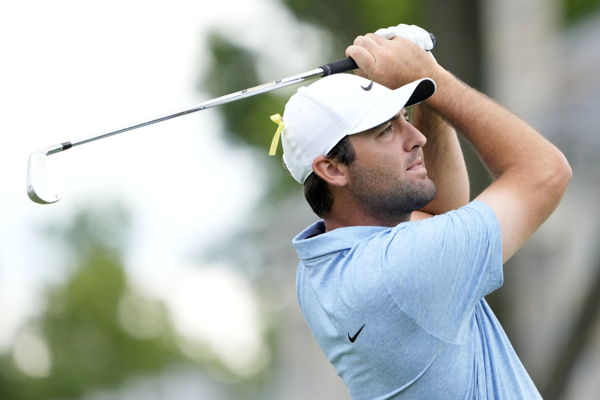 Jun 9, 2024; Dublin, Ohio, USA; Scottie Scheffler hits a shot on the 12th hole during the final round of the Memorial Tournament at Muirfield Village Golf Club.