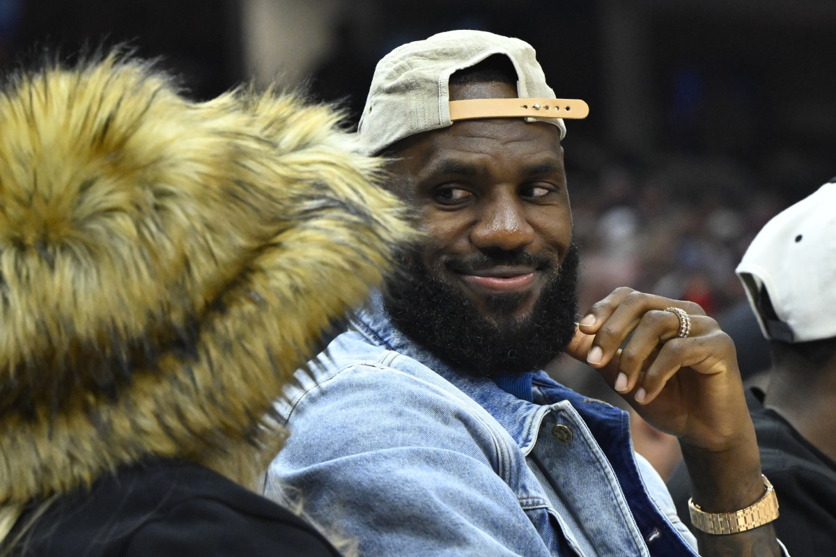 May 13, 2024; Cleveland, Ohio, USA; Los Angeles Lakers forward LeBron James looks at his wife Savannah James in the second quarter of game four of the second round for the 2024 NBA playoffs between the Cleveland Cavaliers and the Boston Celtics at Rocket Mortgage FieldHouse.