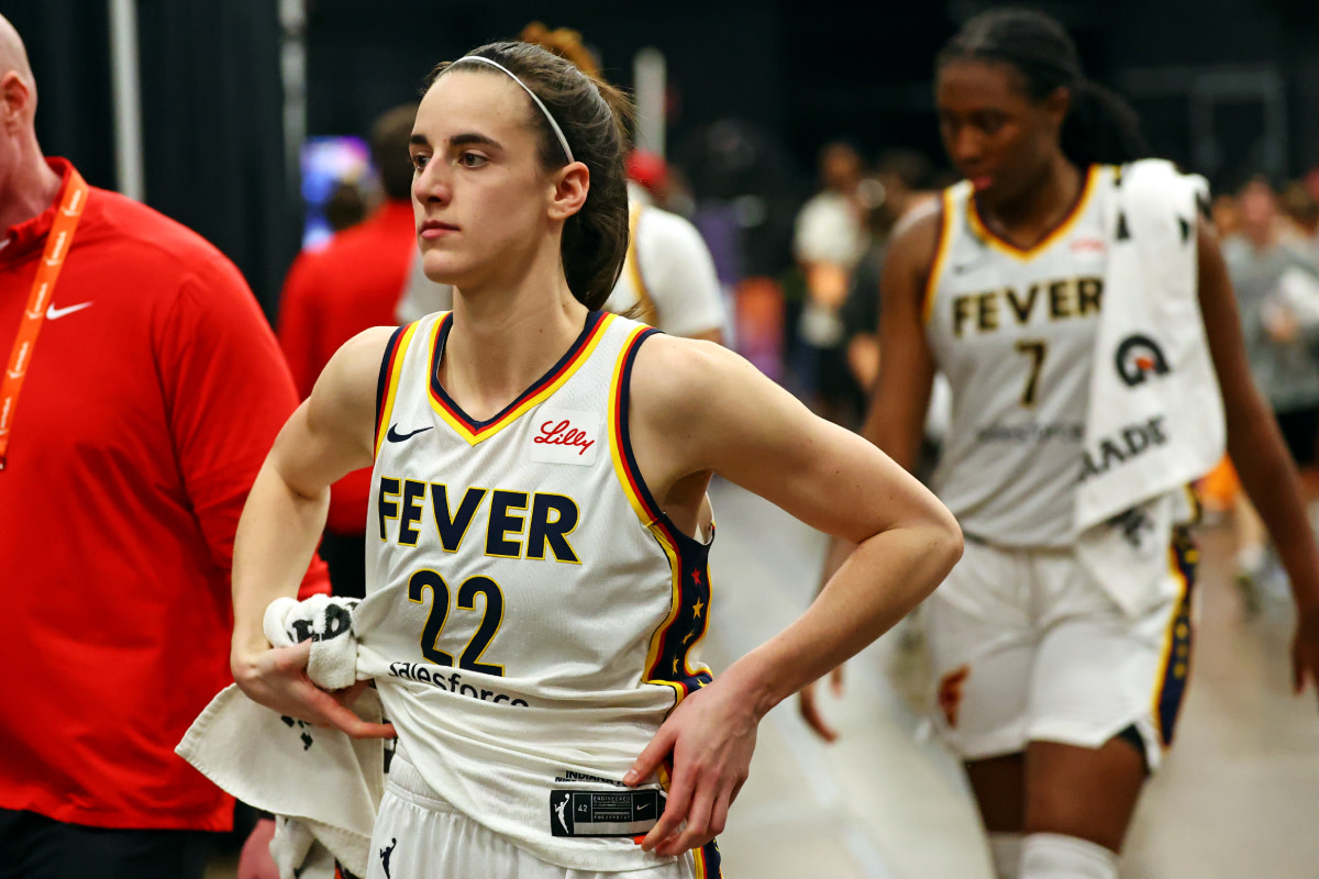 Indiana Fever guard Caitlin Clark walks off the court after the game against the Phoenix Mercury at Footprint Center on June 30, 2023.