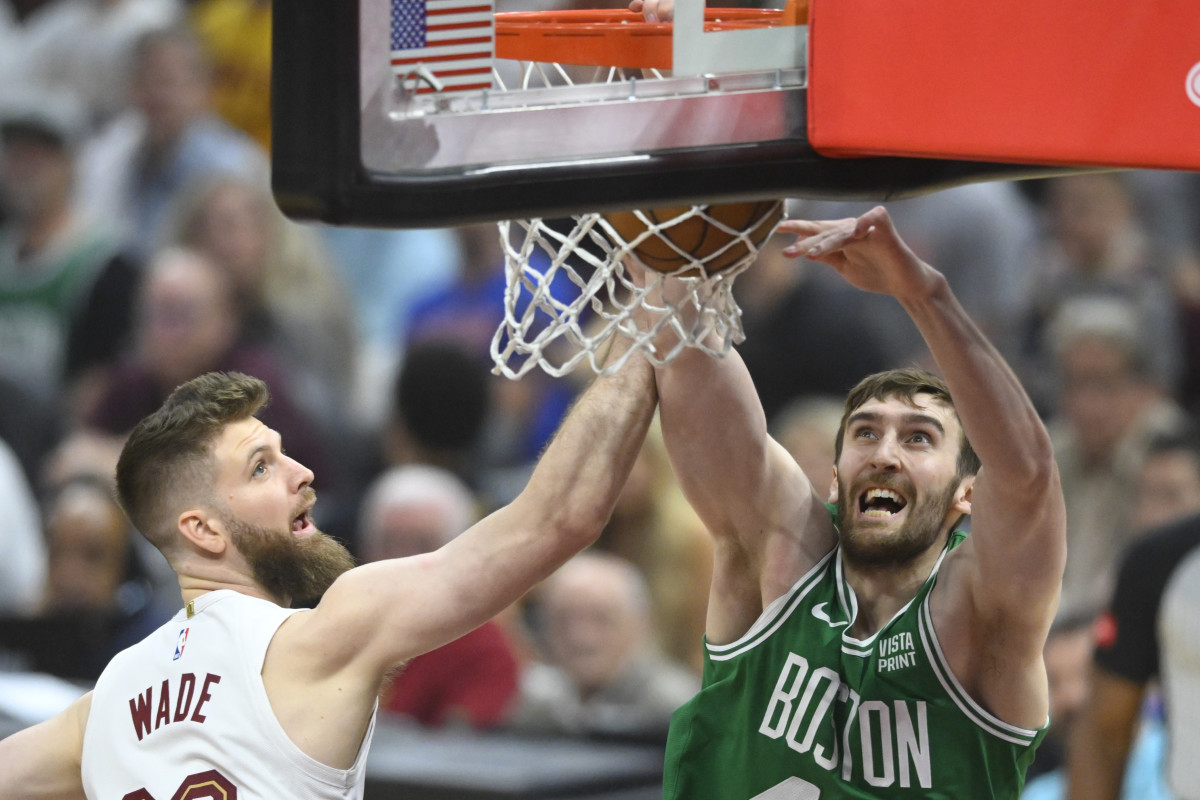 May 13, 2024; Cleveland, Ohio, USA; Boston Celtics center Luke Kornet (40) drunks beside Cleveland Cavaliers forward Dean Wade (32) in the first quarter of game four of the second round for the 2024 NBA playoffs at Rocket Mortgage FieldHouse.