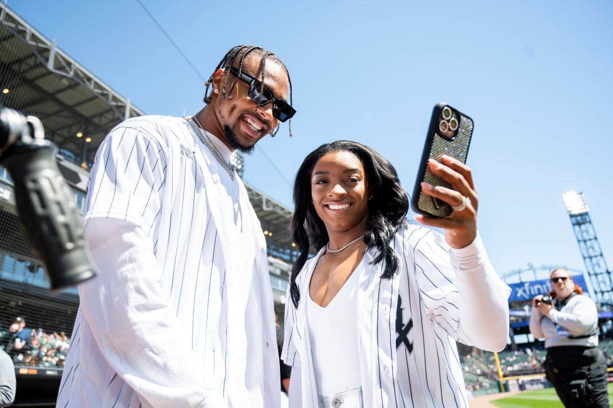 Chicago Bears safety Jonathan Owens and American gymnast Simone Biles at a White Sox game on April 13, 2024.