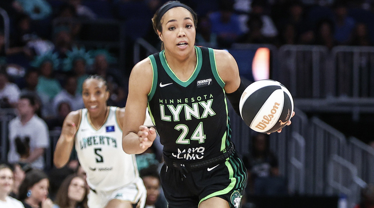 Minnesota Lynx forward Napheesa Collier brings the ball up court as New York Liberty forward Kayla Thornton trails the play at UBS Arena in Elmont, New York, on June 25, 2024.