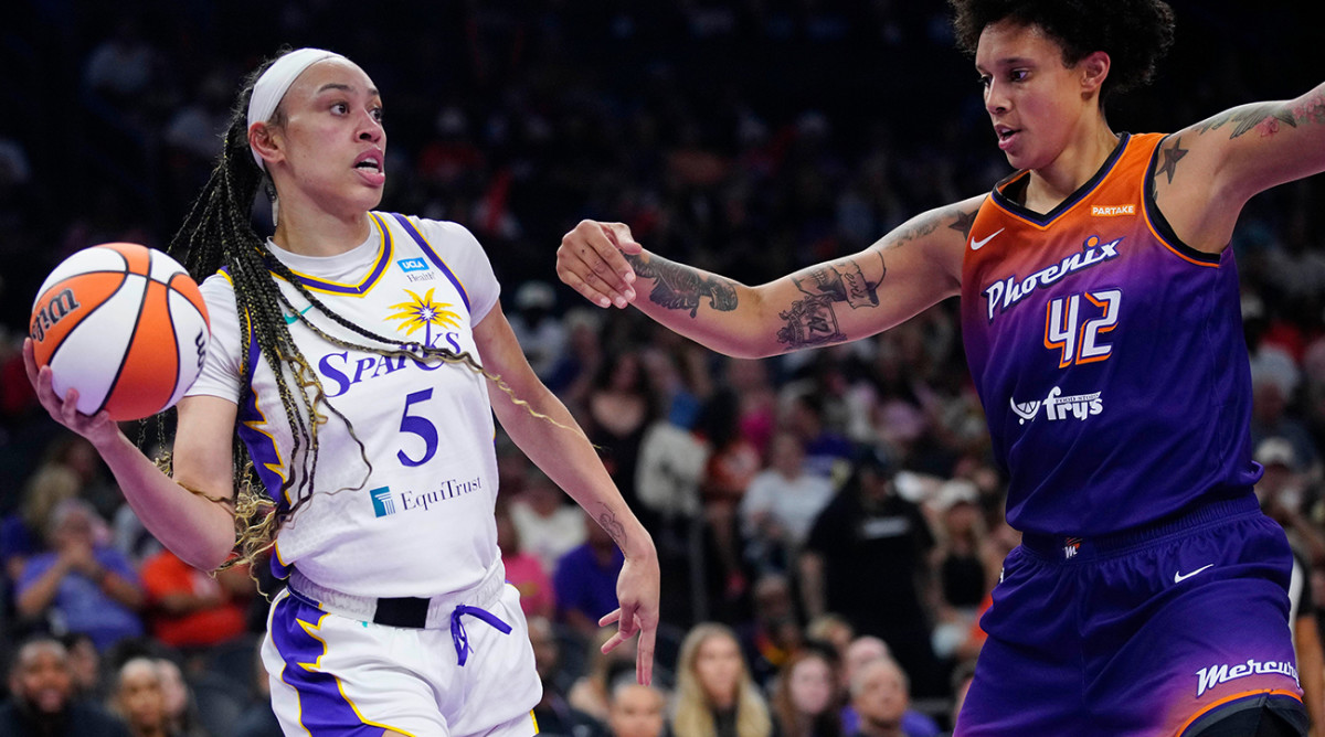 Los Angeles Sparks center Dearica Hamby looks to pass the ball as Phoenix Mercury center Brittney Griner defends during a game at Footprint Center on June 28, 2024.