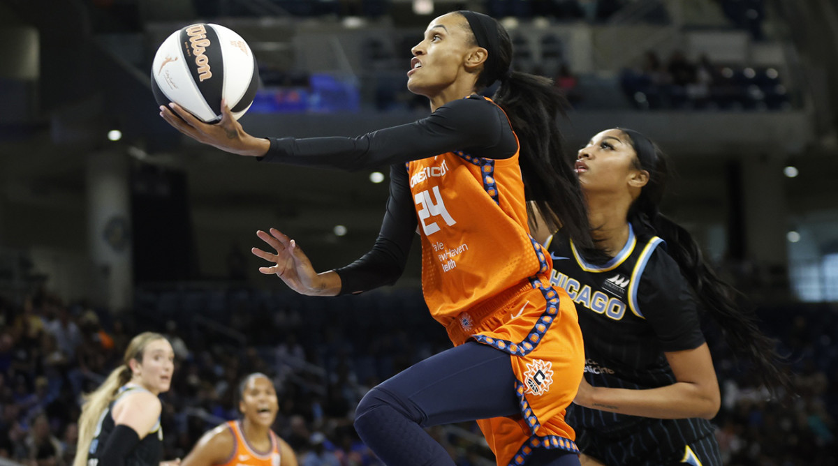 Connecticut Sun forward DeWanna Bonner drives to the basket as Chicago Sky forward Angel Reese defends at Wintrust Arena on June 12, 2024.