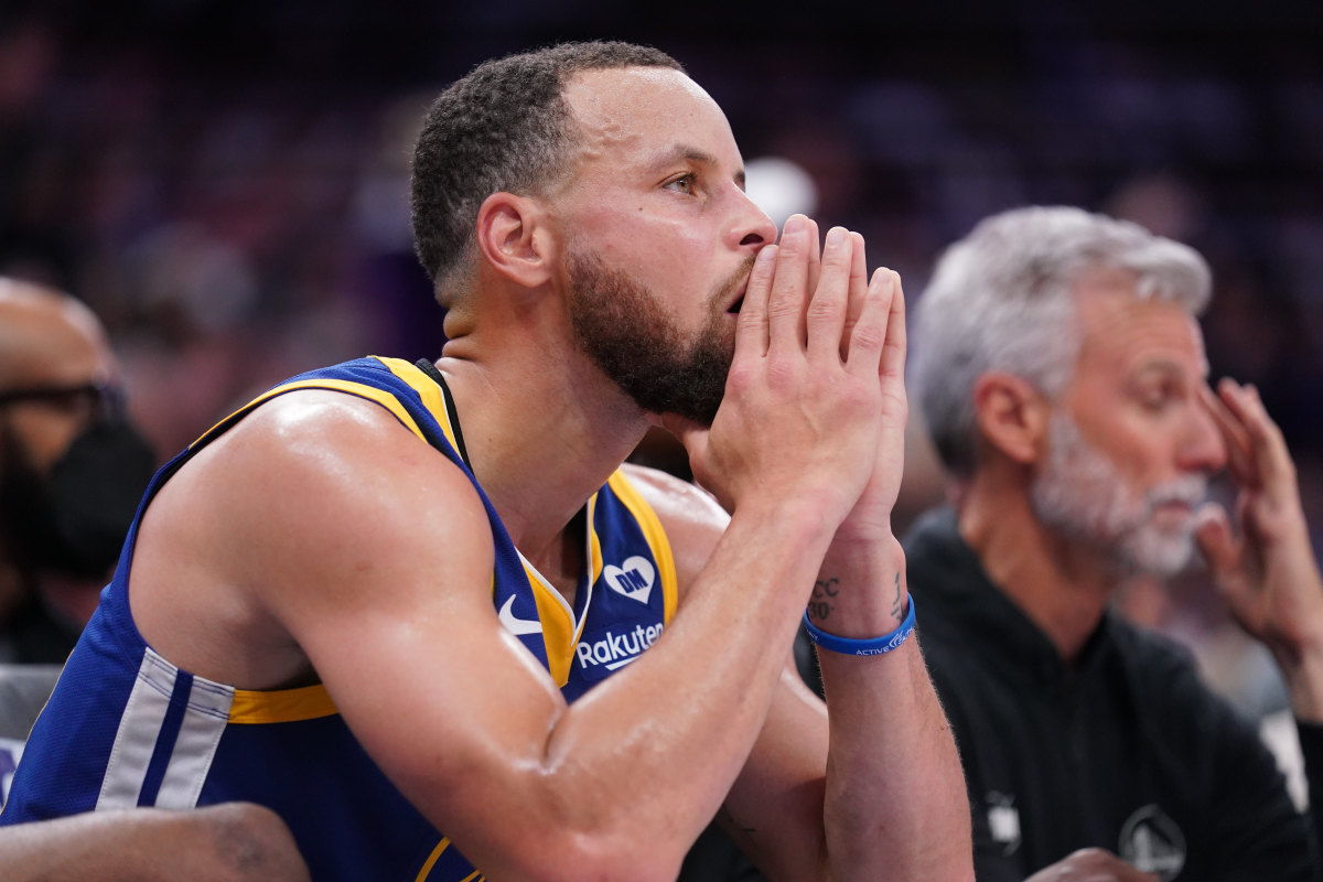 Golden State Warriors guard Stephen Curry (30) sits on the bench during action against the Sacramento Kings.