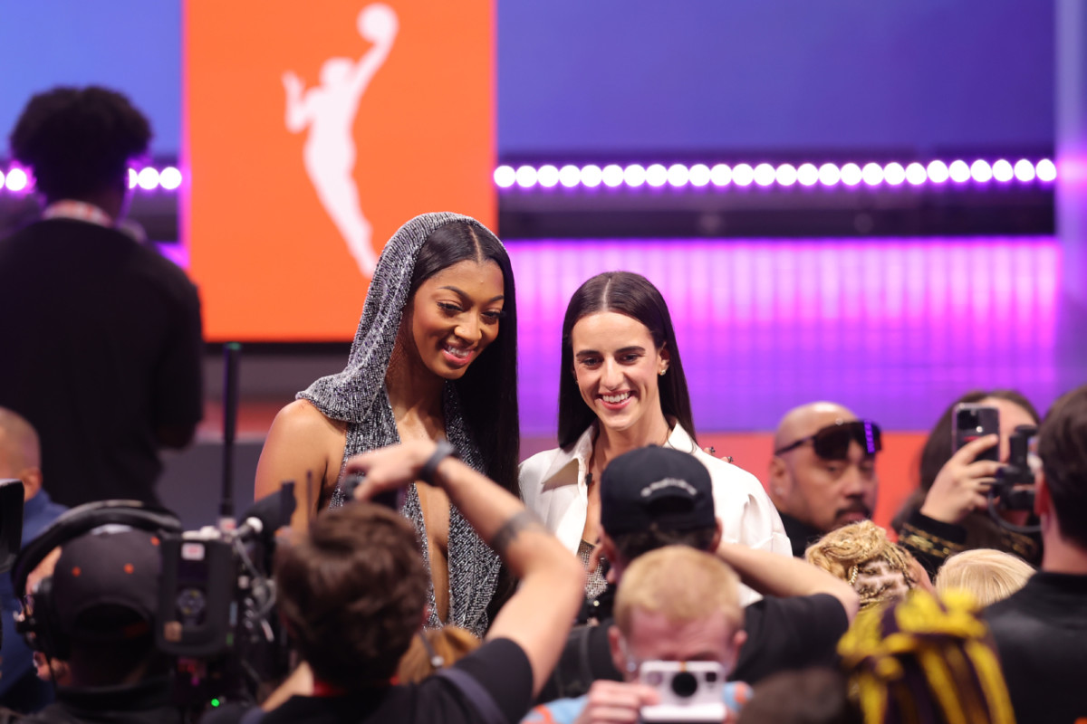 Angel Reese and Caitlin Clark pose for photos before the 2024 WNBA Draft at Brooklyn Academy of Music.