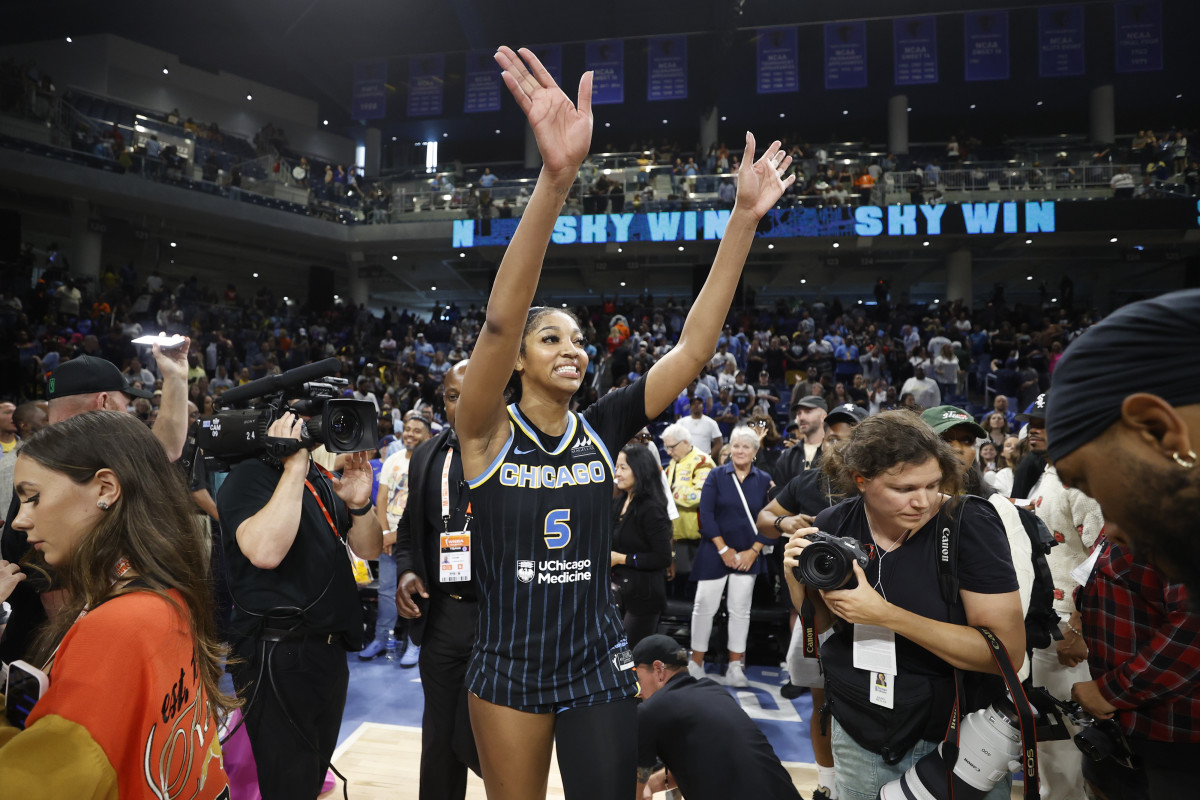 Jun 23, 2024; Chicago, Illinois, USA; Chicago Sky forward Angel Reese (5) waves to fans after defeating the Indiana Fever at Wintrust Arena.