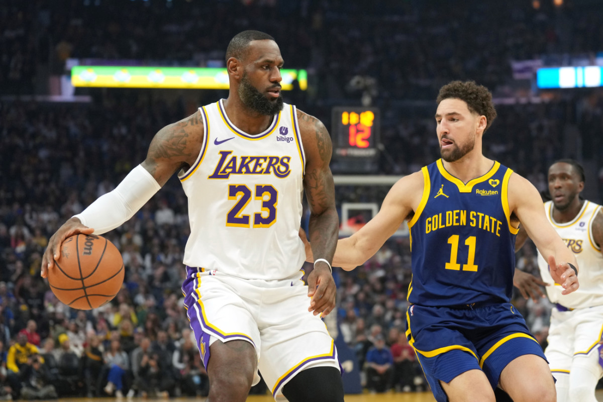 Los Angeles Lakers forward LeBron James (23) dribbles against Golden State Warriors guard Klay Thompson (11) during the first quarter at Chase Center.
