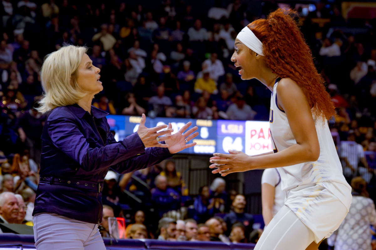 LSU Lady Tigers head coach Kim Mulkey, left, and LSU Lady Tigers forward Angel Reese talk during the second half against the Auburn Tigers at Pete Maravich Assembly Center.