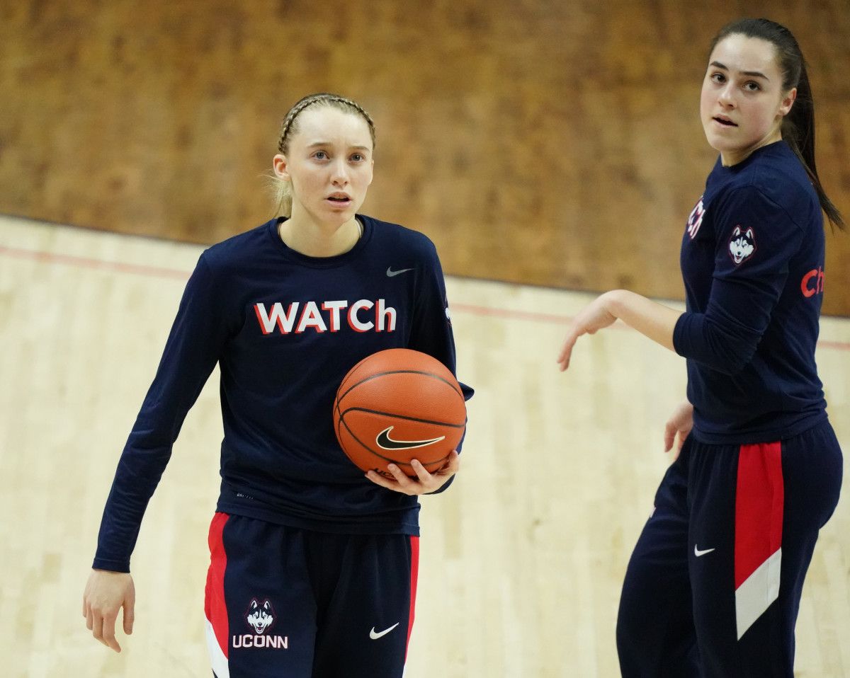 UConn Huskies guard Paige Bueckers (5) (left) and guard Nika Muhl (right) warm up before a game against the Marquette Golden Eagles at Harry A. Gampel Pavilion.