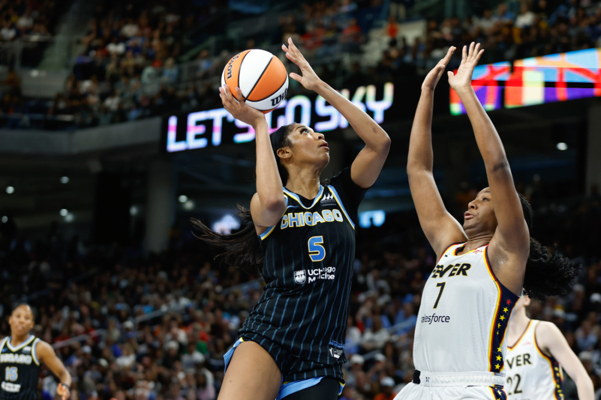 Chicago Sky forward Angel Reese (5) goes to the basket against Indiana Fever forward Aliyah Boston (7) during the second half of a basketball game at Wintrust Arena.