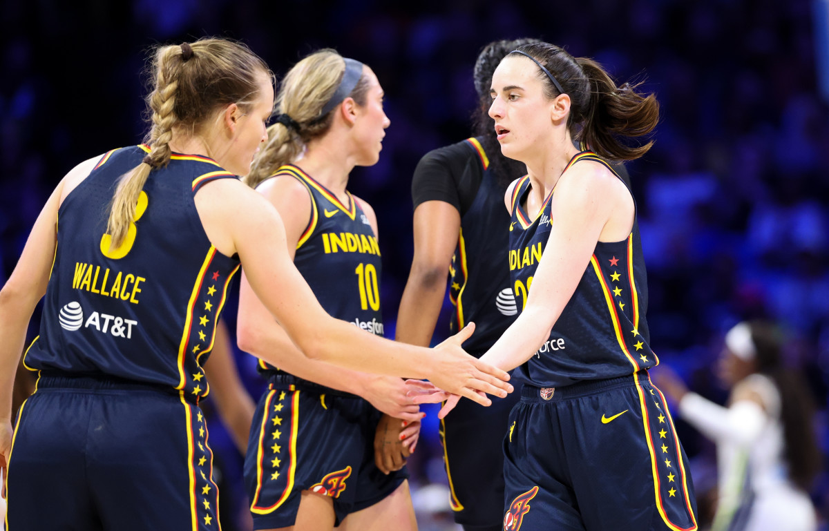 May 3, 2024; Dallas, TX; Indiana Fever guard Caitlin Clark (22) celebrates with fellow guard Kristy Wallace (3) during the second quarter against the Dallas Wings at College Park Center.