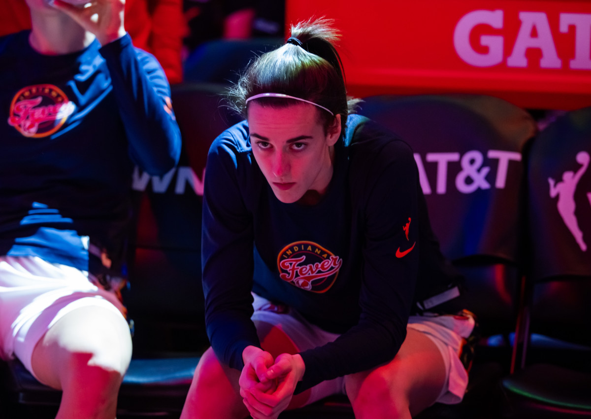 Jun 30, 2024; Phoenix, Arizona, USA; Indiana Fever guard Caitlin Clark (22) against the Phoenix Mercury during a WNBA game at Footprint Center.