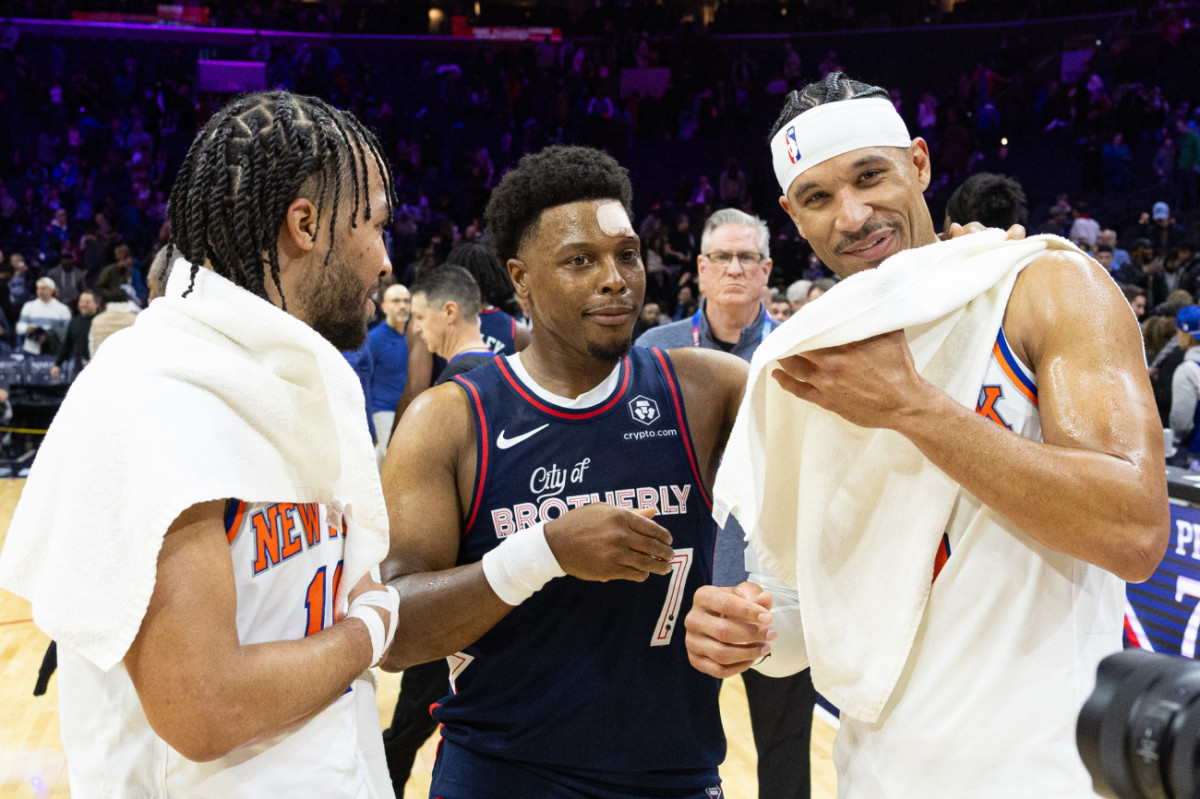 Villanova Wildcats alumni New York Knicks guard Jalen Brunson (11) and guard Josh Hart (3) and Philadelphia 76ers guard Kyle Lowry (7) meet on the court after a game at Wells Fargo Center.