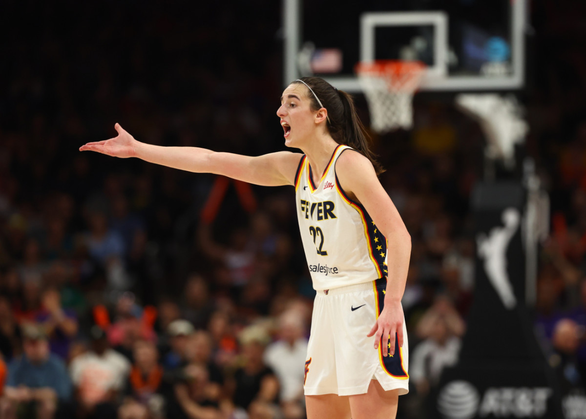 Indiana Fever guard Caitlin Clark (22) reacts against the Phoenix Mercury during a WNBA game at Footprint Center.