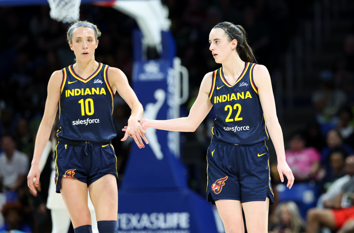 May 3, 2024; Dallas, Texas, USA; Indiana Fever guard Caitlin Clark (22) celebrates with Indiana Fever guard Lexie Hull (10) during the second quarter against the Dallas Wings at College Park Center.