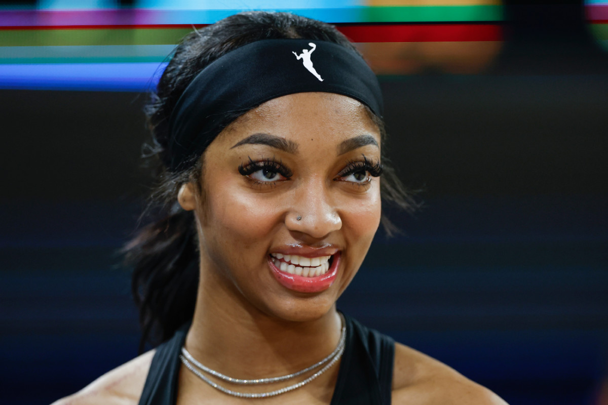 Chicago Sky forward Angel Reese (5) smiles before a basketball game against the Connecticut Sun at Wintrust Arena.