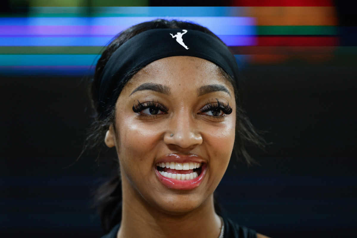 Chicago Sky forward Angel Reese (5) smiles before a basketball game against the Connecticut Sun at Wintrust Arena.