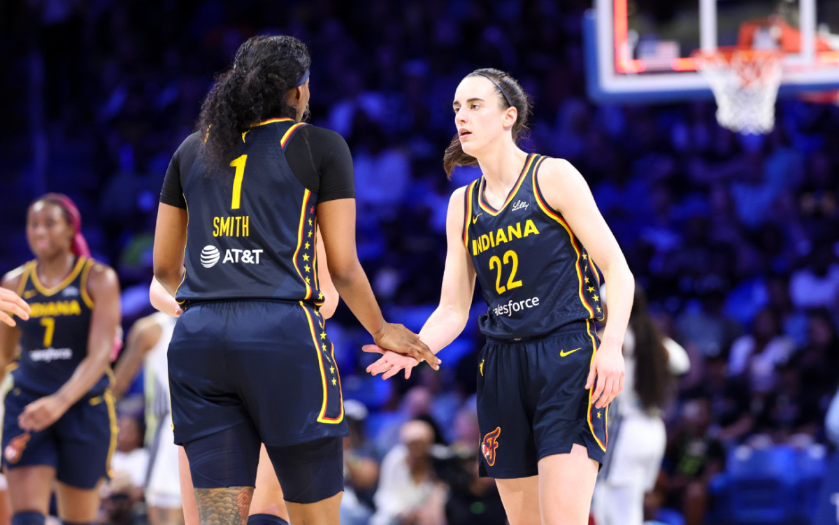 Indiana Fever guard Caitlin Clark (22) celebrates with Indiana Fever forward NaLyssa Smith (1) at College Park Center on May 3, 2024.