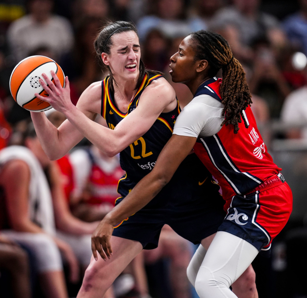 Washington Mystics guard Ariel Atkins (7) guards Indiana Fever guard Caitlin Clark (22) Wednesday, July 10, 2024, during the game at Gainbridge Fieldhouse in Indianapolis.