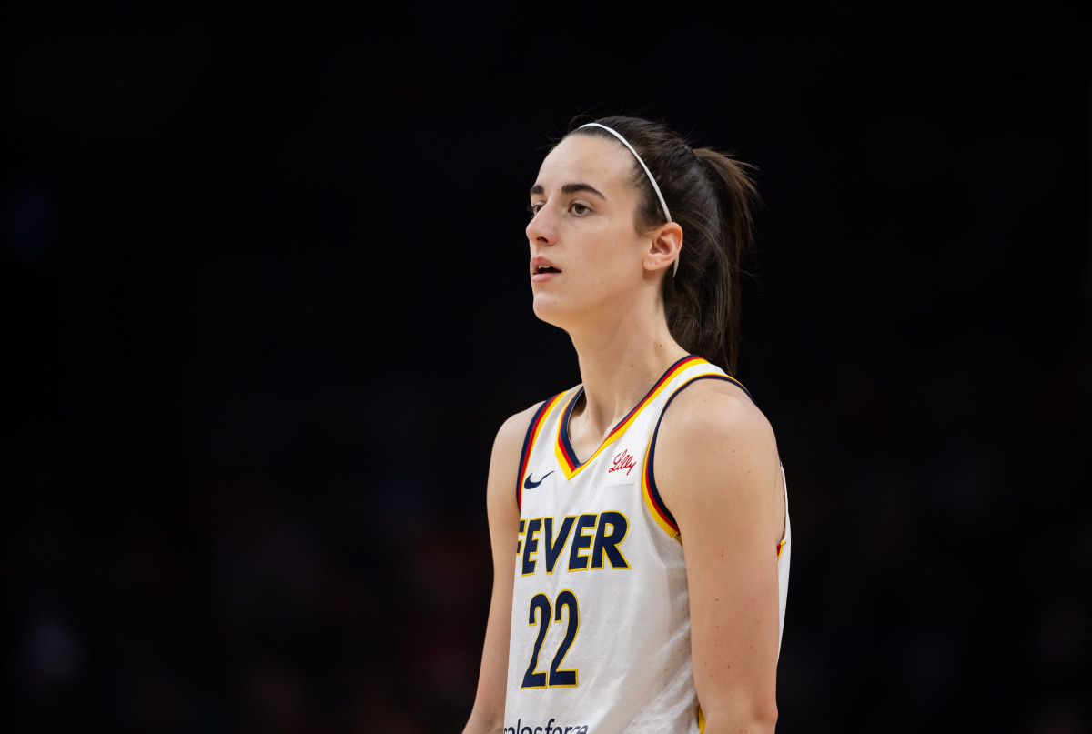 Jun 30, 2024; Phoenix, Arizona, USA; Indiana Fever guard Caitlin Clark (22) against the Phoenix Mercury during a WNBA game at Footprint Center.