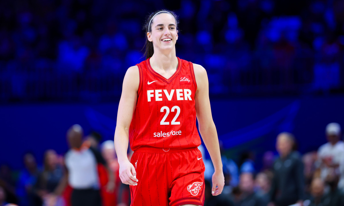 Indiana Fever guard Caitlin Clark (22) reacts during the first half against the Dallas Wings at College Park Center