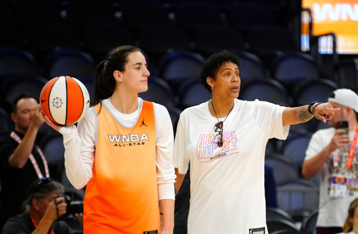 WNBA All-Star coach Cheryl Miller talks to Fever guard Caitlin Clark on Media Day at the Footprint Center on July 19, 2024.