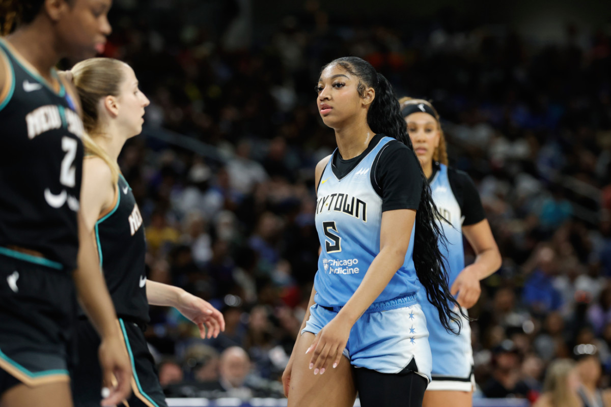 Chicago Sky forward Angel Reese (5) walks on the court during the first half of a WNBA game against the New York Liberty at Wintrust Arena.