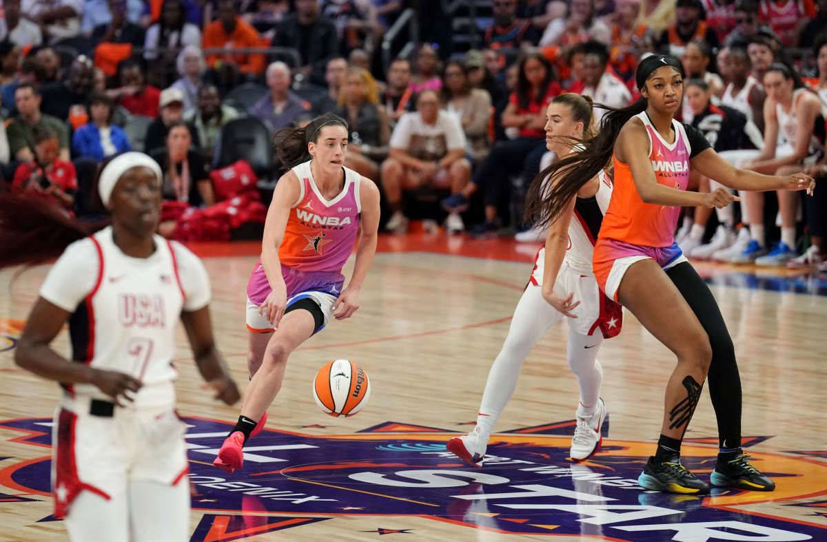 July 20, 2024; Phoenix, AZ; Team WNBA forward Angel Reese (5) sets a pick for Team WNBA guard Caitlin Clark (22) during the WNBA All Star Game against USA Women's National Team at Footprint Center.