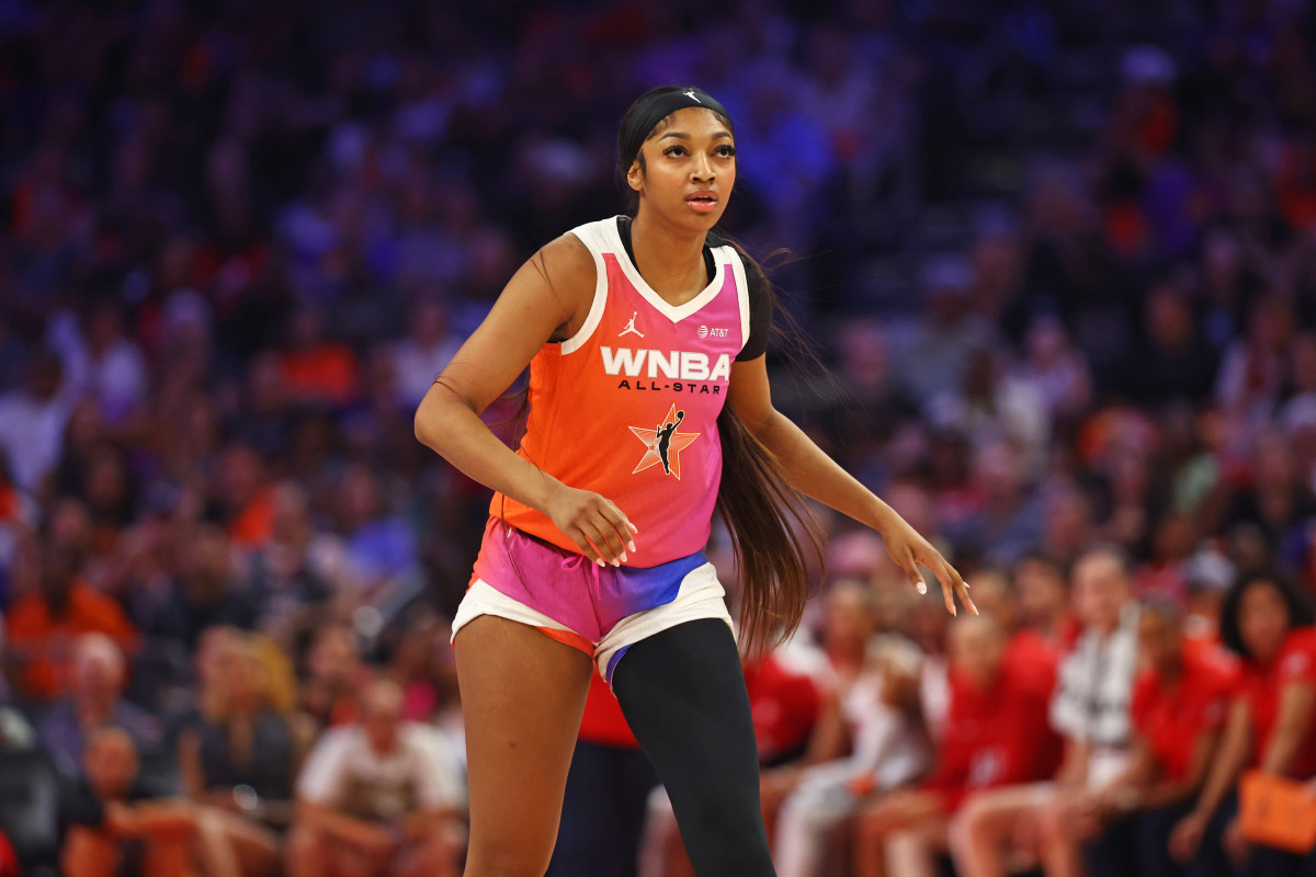 Jul 20, 2024; Phoenix, AZ, USA; Team WNBA forward Angel Reese (5) looks on during the first half against the USA Women's National Team at Footprint Center.