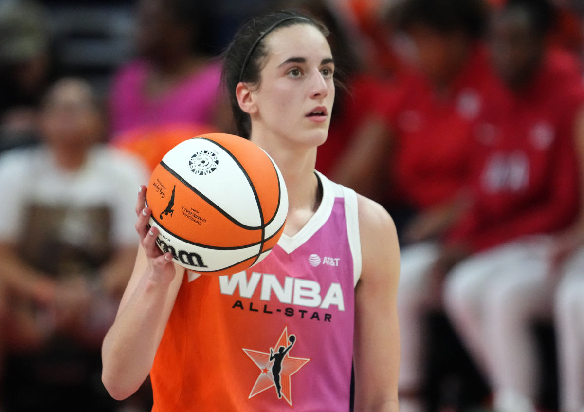 Jul 20, 2024; Phoenix, AZ, USA; Team WNBA guard Caitlin Clark (22) dribbles against USA Women's National Team during the WNBA All Star Game at Footprint Center.