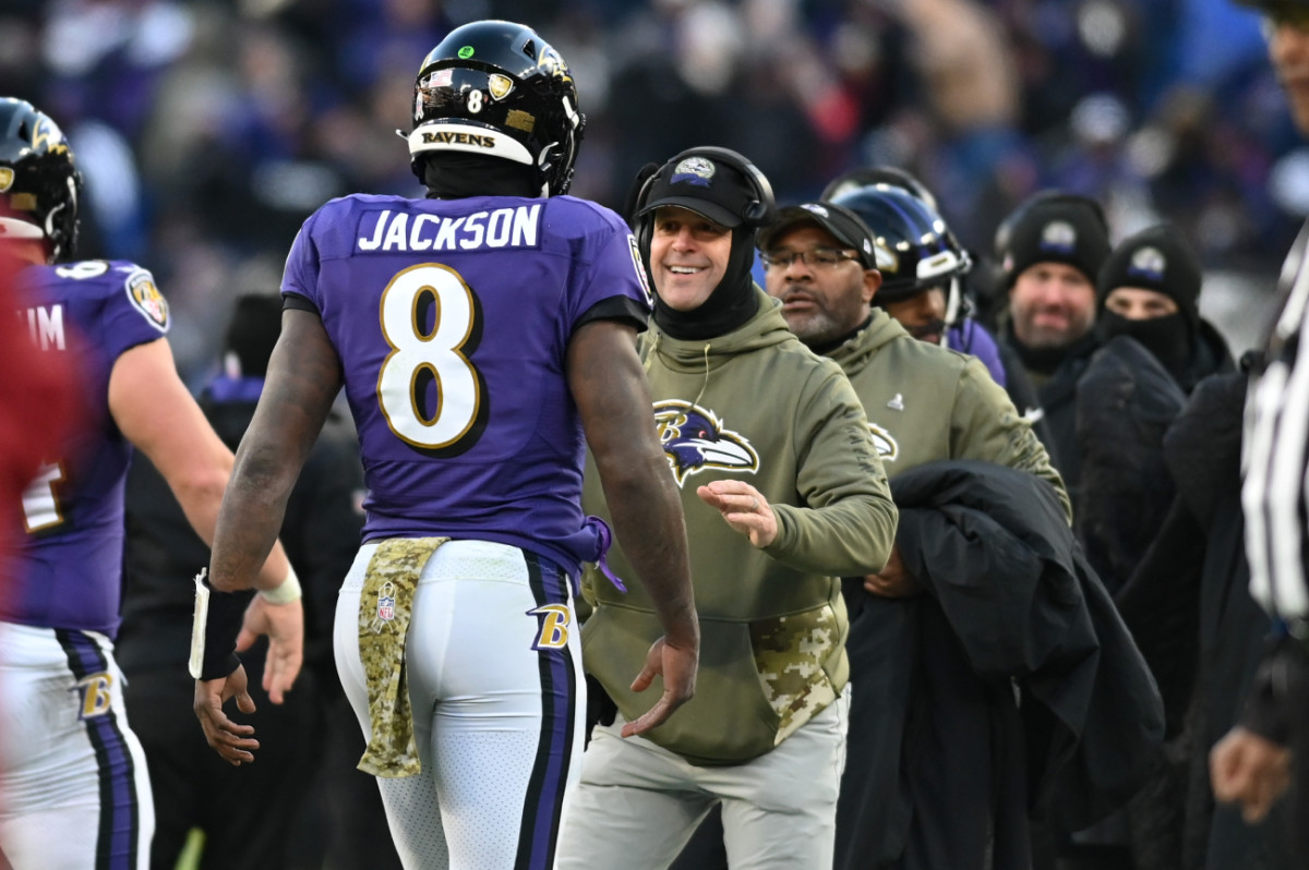 Nov 20, 2022; Baltimore, Maryland, USA; Baltimore Ravens head coach John Harbaugh greats Baltimore Ravens quarterback Lamar Jackson (8) after scoring a second half touchdown against the Carolina Panthers at M&T Bank Stadium.