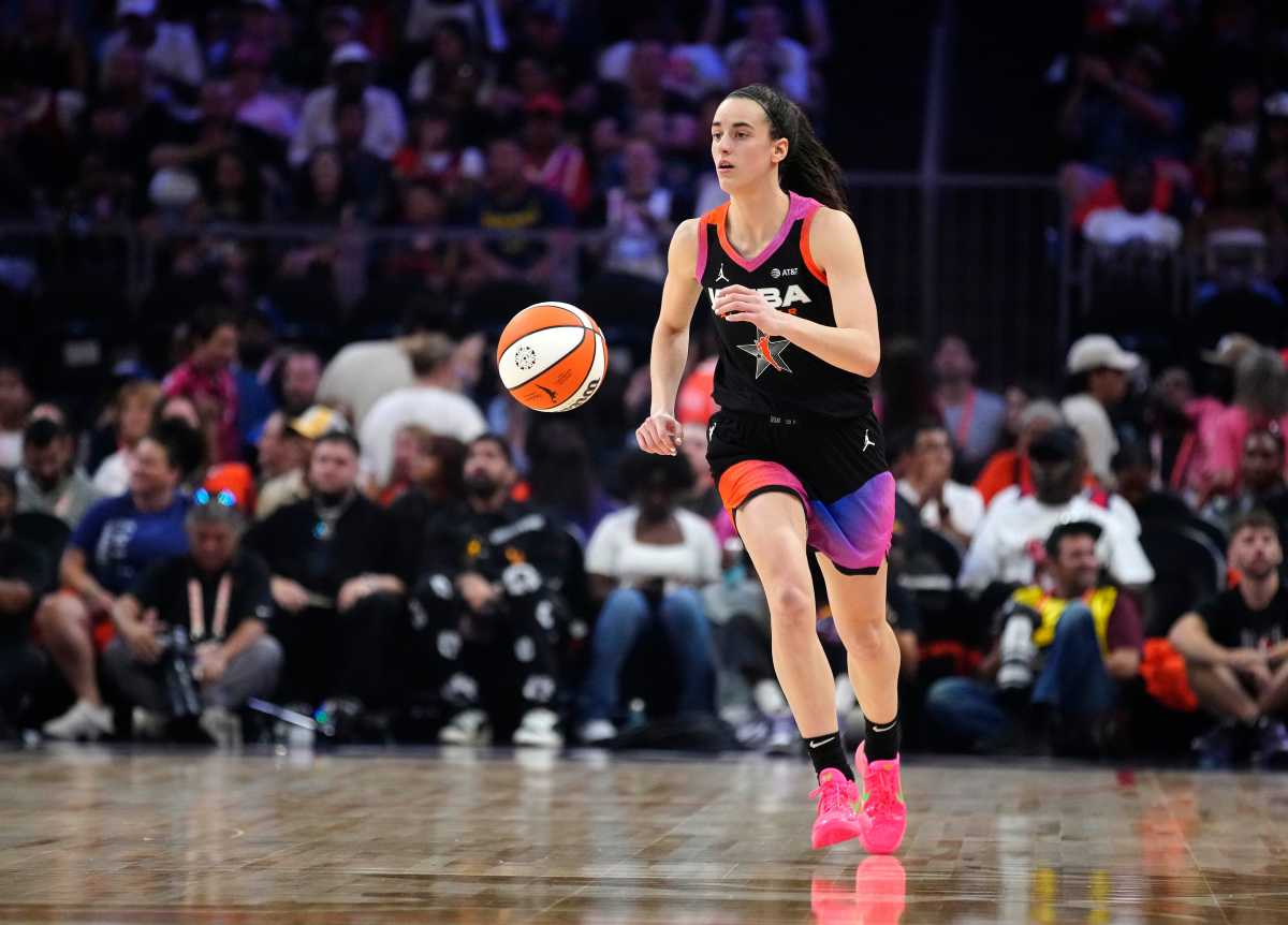 Team WNBA guard Caitlin Clark dribbles up the court against Team USA during the WNBA All-Star Game at Footprint Center in Phoenix 