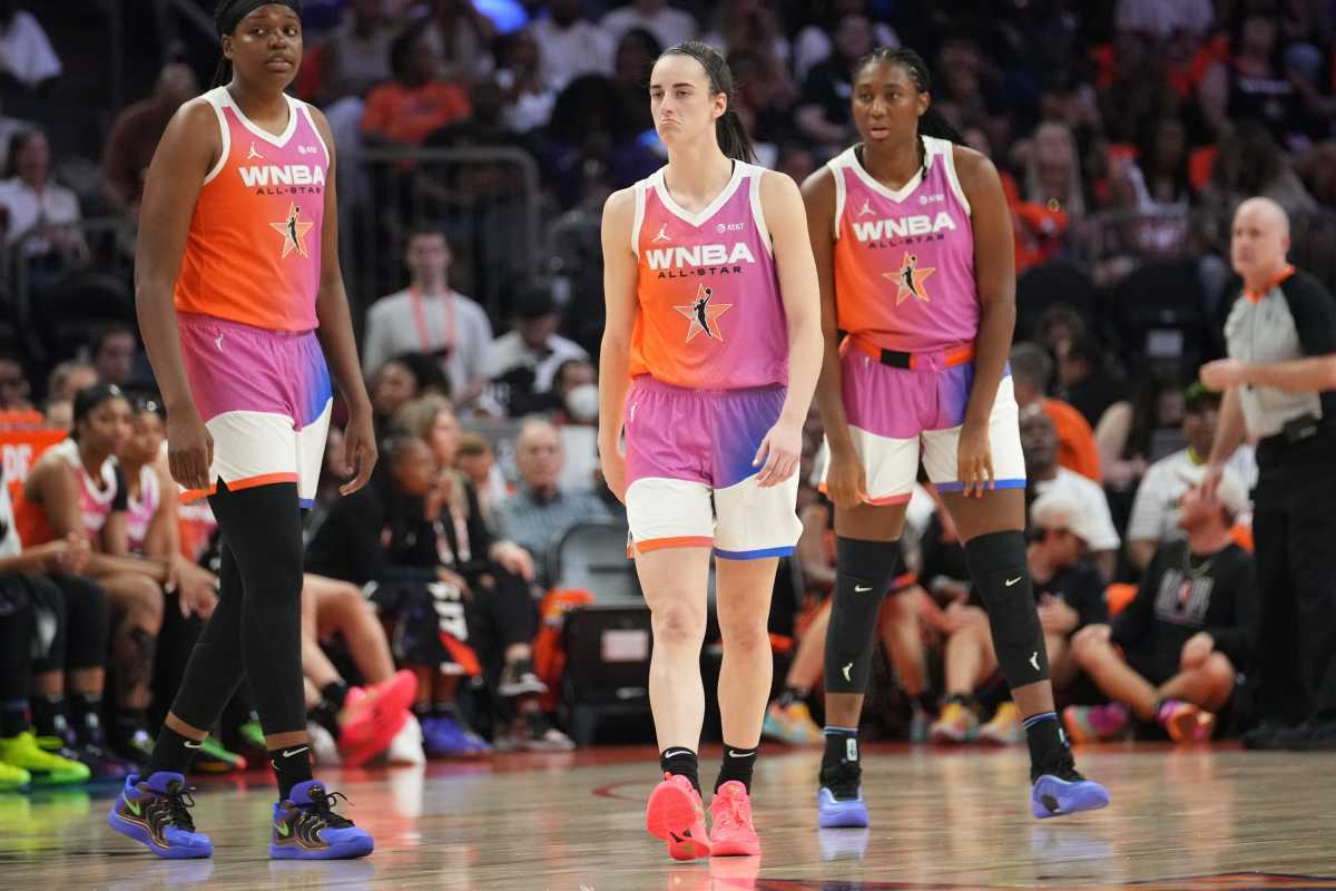 Team WNBA teammates Caitlin Clark (22), center, forward Aliyah Boston (7), right, and center Jonquel Jones (35) take on Team USA during the WNBA All-Star Game at Footprint Center in Phoenix on Saturday, July 20, 2024. 