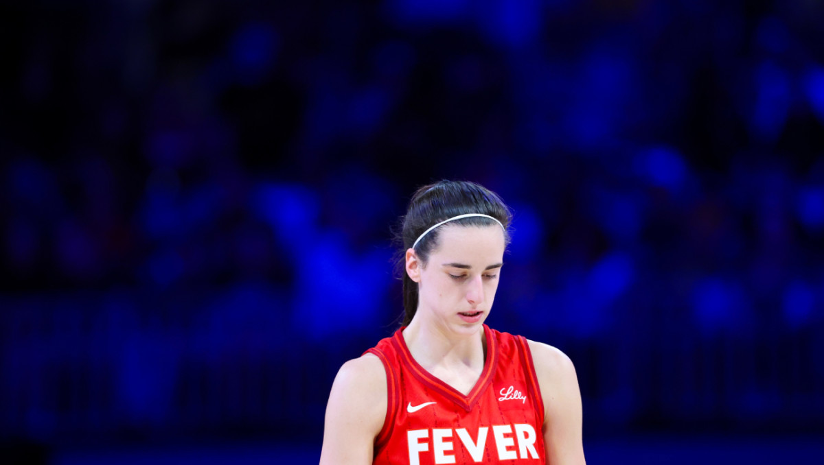 Indiana Fever guard Caitlin Clark (22) reacts during the first half against the Dallas Wings at College Park Center.