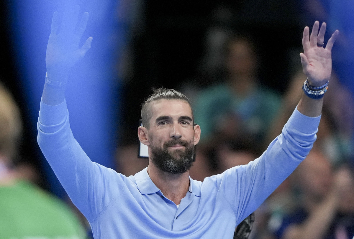 Michael Phelps waves to the crowd ahead of the night round of competition during the Paris 2024 Olympic Summer Games at Paris La Défense Arena.