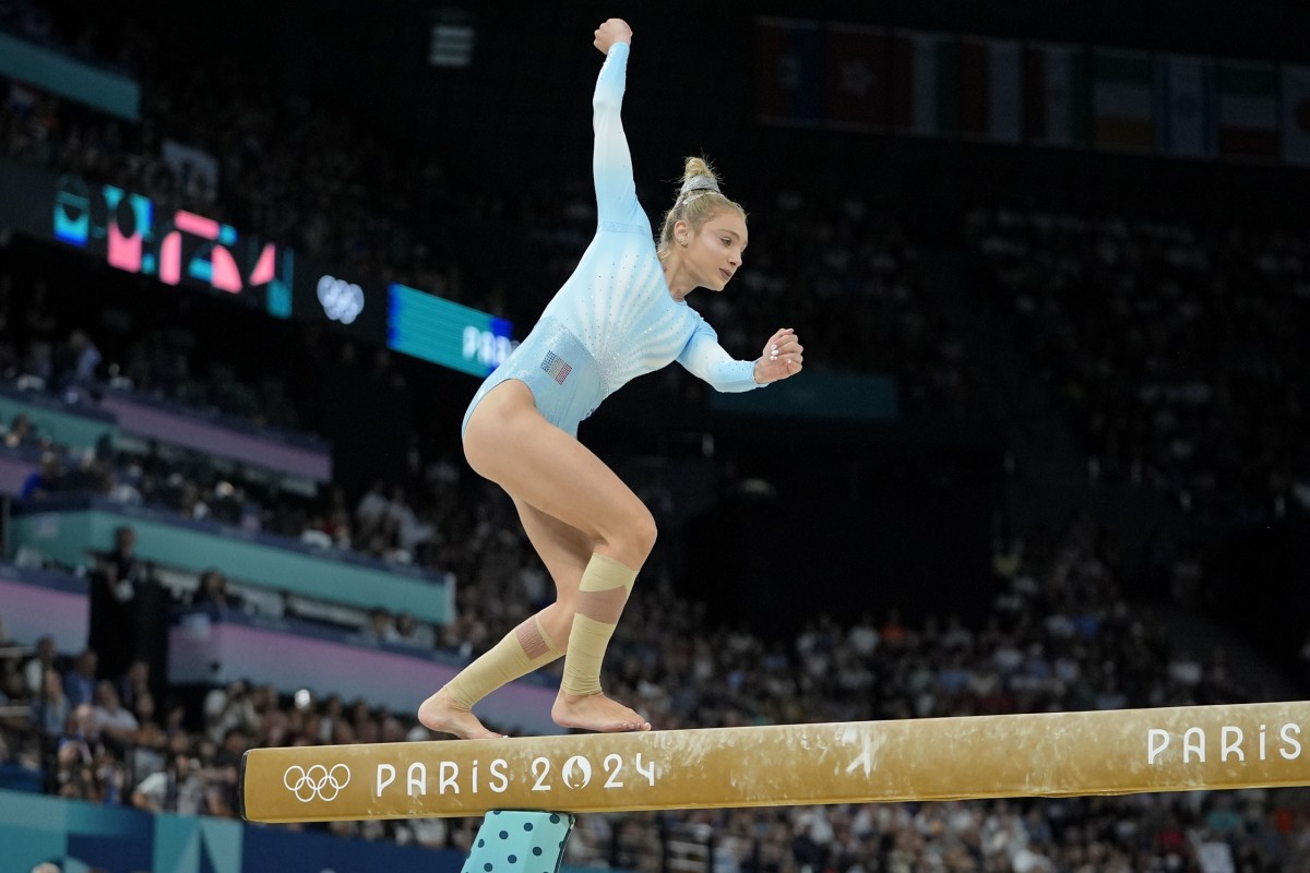 Sabrina Maneca-Voinea of Romania checks her balance on the beam on day three of the gymnastics event finals during the Paris 2024 Olympic Summer Games. 