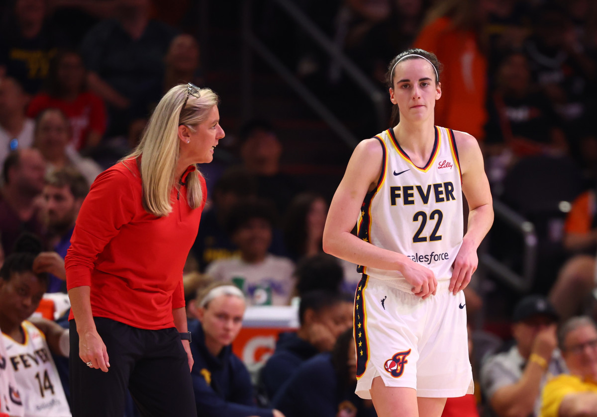 Indiana Fever head coach Christie Sides and guard Caitlin Clark (22)