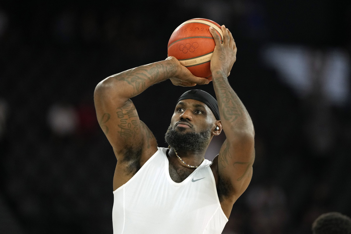 United States guard LeBron James warms up before the men's basketball gold medal game against France at the Paris 2024 Olympics.