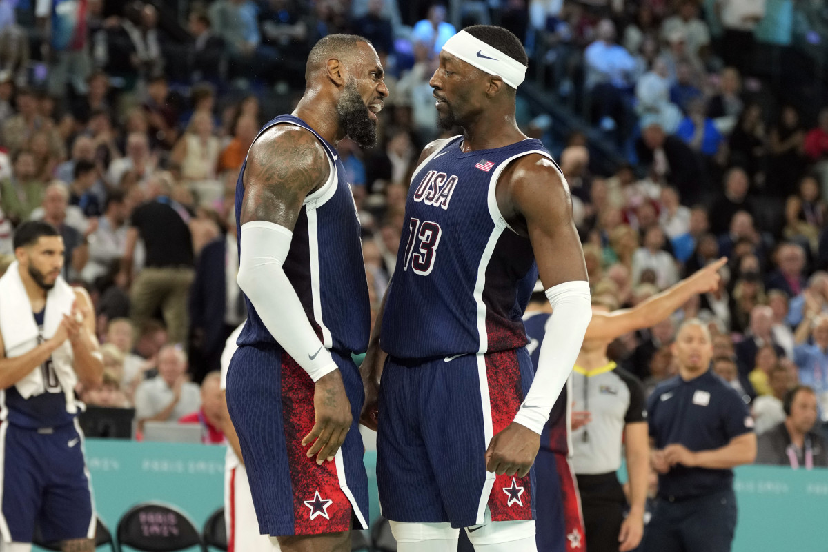 United States guard LeBron James (6) and center Bam Adebayo (13) react in the first half against France in the men's basketball gold medal game during the Paris 2024 Olympic Summer Games at Accor Arena.