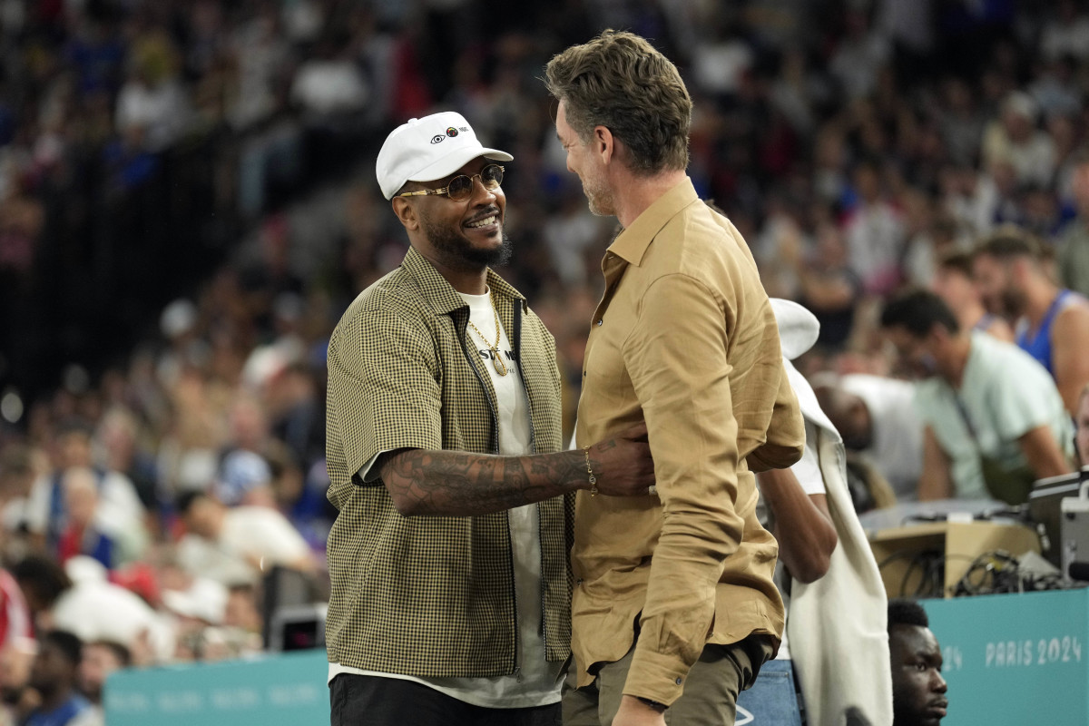 Carmelo Anthony and Pau Gasol embrace in the first half between France and Canada in a mens basketball quarterfinal game during the Paris 2024 Olympic Summer Games at Accor Arena.