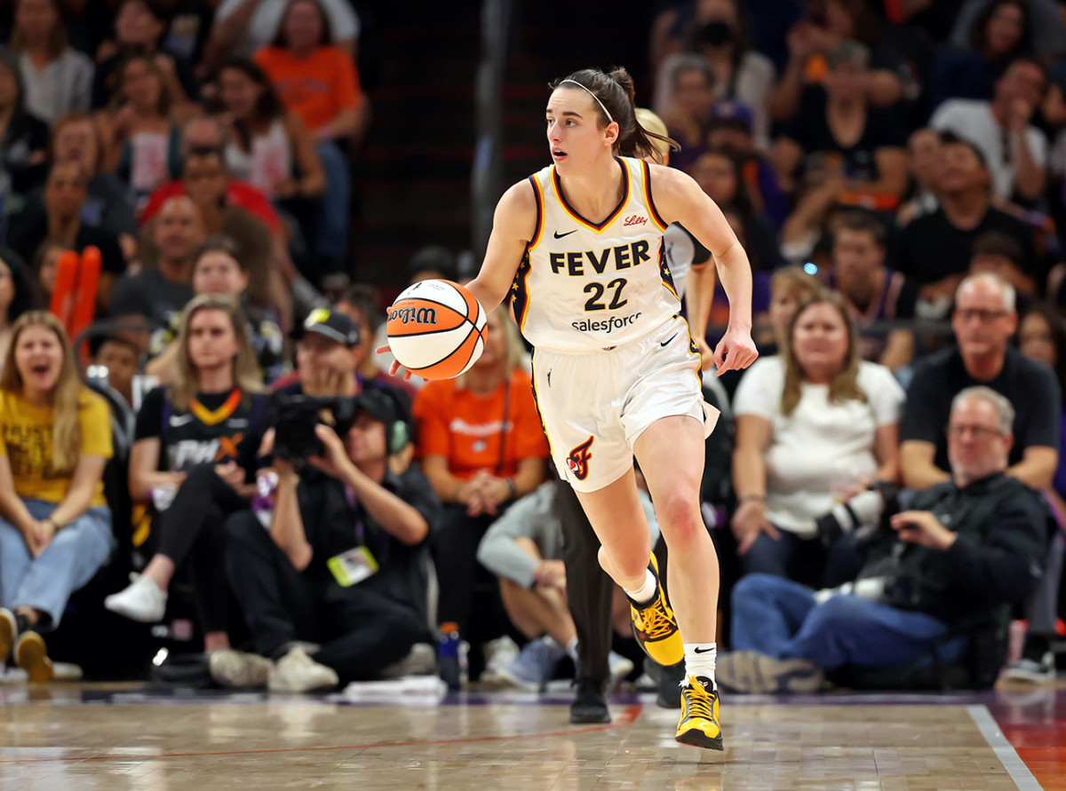 Jun 30, 2024; Phoenix, Arizona, USA; Indiana Fever guard Caitlin Clark (22) against the Phoenix Mercury during a WNBA game at Footprint Center. 