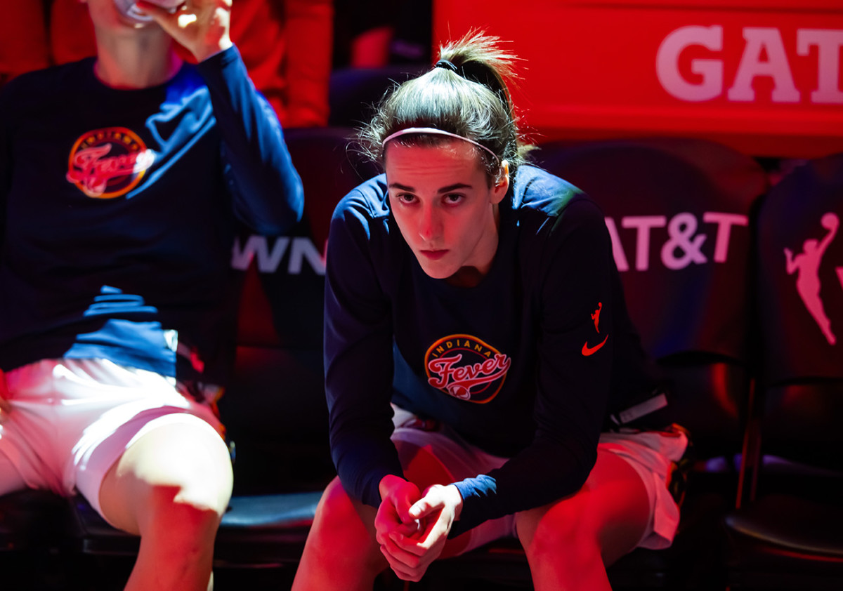 Jun 30, 2024; Phoenix, Arizona, USA; Indiana Fever guard Caitlin Clark (22) against the Phoenix Mercury during a WNBA game at Footprint Center.